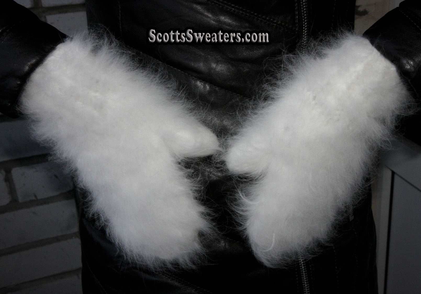 White fluffy handknit angora mittens worn with black jacket