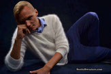 Men's Angora Sweater ultra-soft white angora V-neck sweater worn by model lying down against dark background
