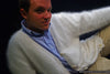 Men's ultra-soft angora cardigan sweater in white worn over a blue shirt