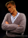 Men's ultra-soft angora cardigan sweater worn by man with crossed arms against black background