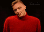 Men's ultra-soft angora turtleneck sweater in red worn by model