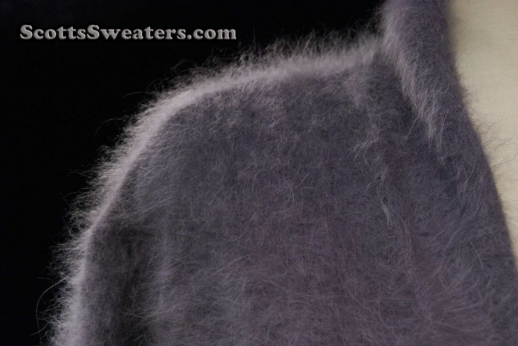 Woman's open-front angora cardigan sweater with turn-down collar and lantern sleeves by Cocol