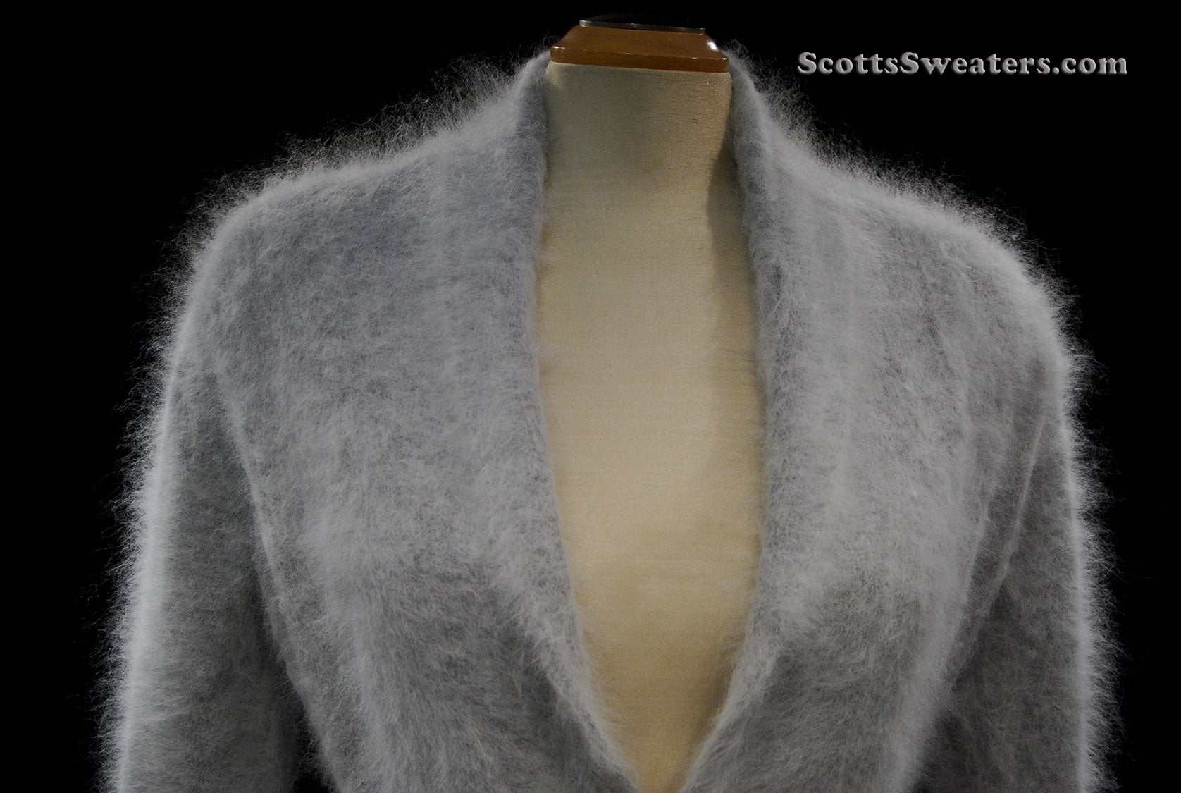 Woman wearing ultra-soft open-front angora cardigan sweater with turn-down collar and lantern sleeves by Cocol