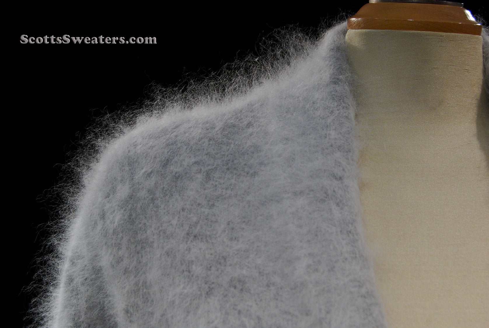 Woman wearing ultra-soft open-front angora cardigan sweater with turn-down collar and lantern sleeves by Cocol