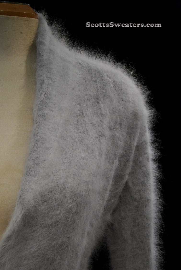 Woman wearing ultra-soft open-front angora cardigan sweater with turn-down collar and matching belt