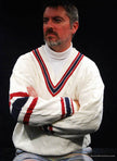 Men's sporty V-neck pullover cotton cable-knit sweater with red and navy blue striped trim and crossed tennis rackets emblem