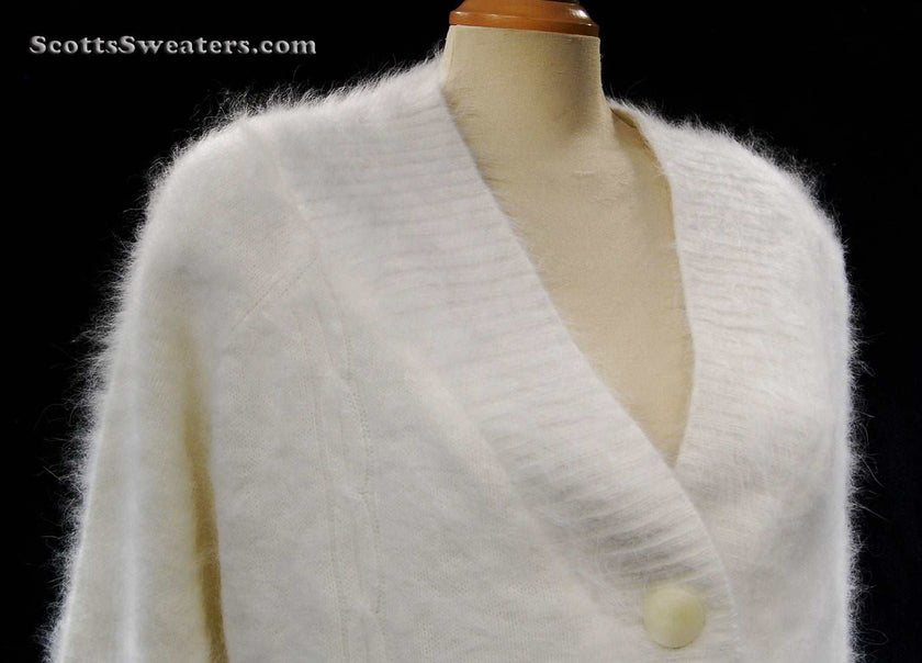 Woman wearing white angora shawl-neck cardigan sweater with single-button closure by Lee Sands, Missy-One-Size