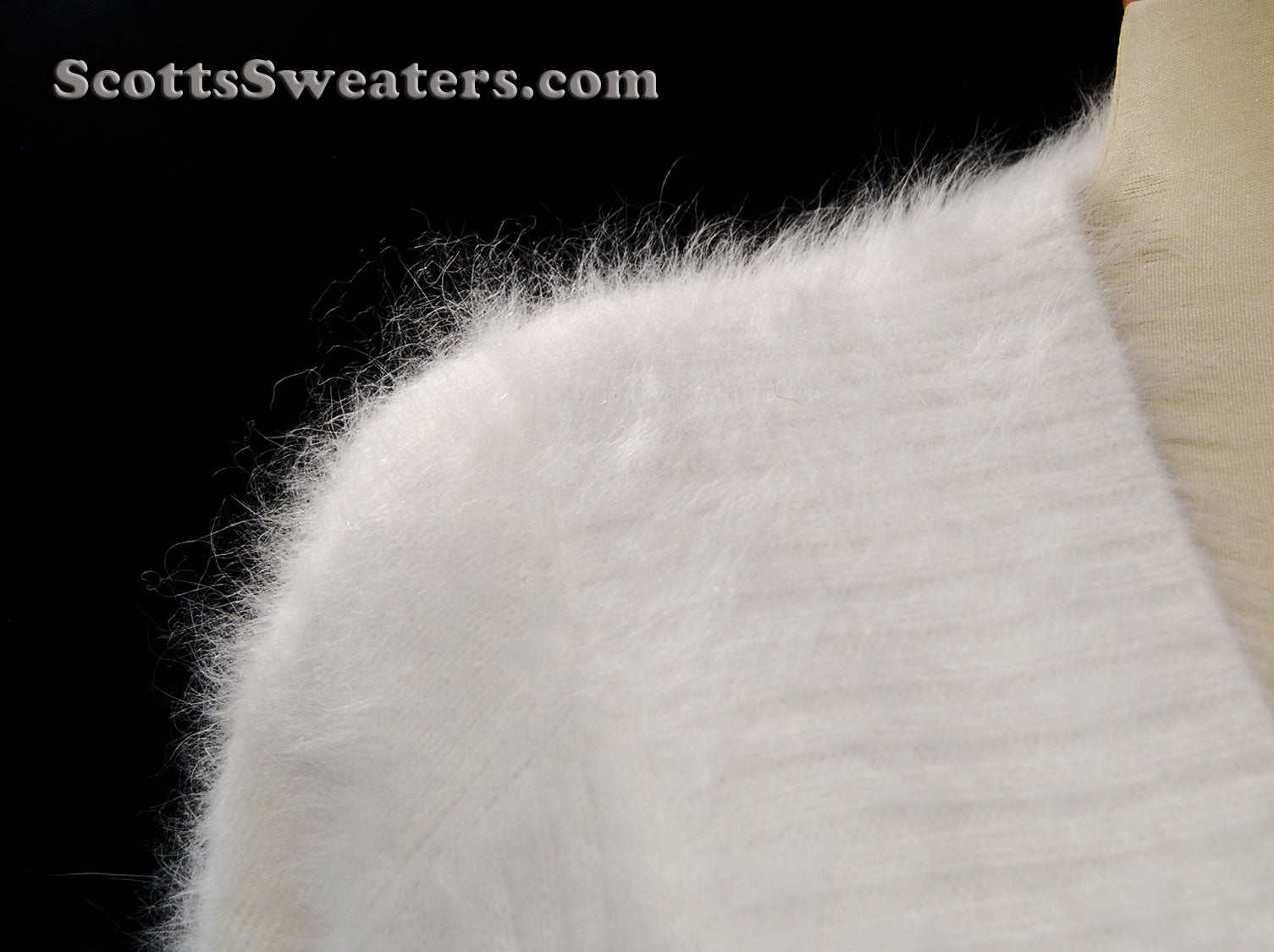 Woman's white angora shawl-neck cardigan sweater with single-button closure by Lee Sands for plus and missy sizes