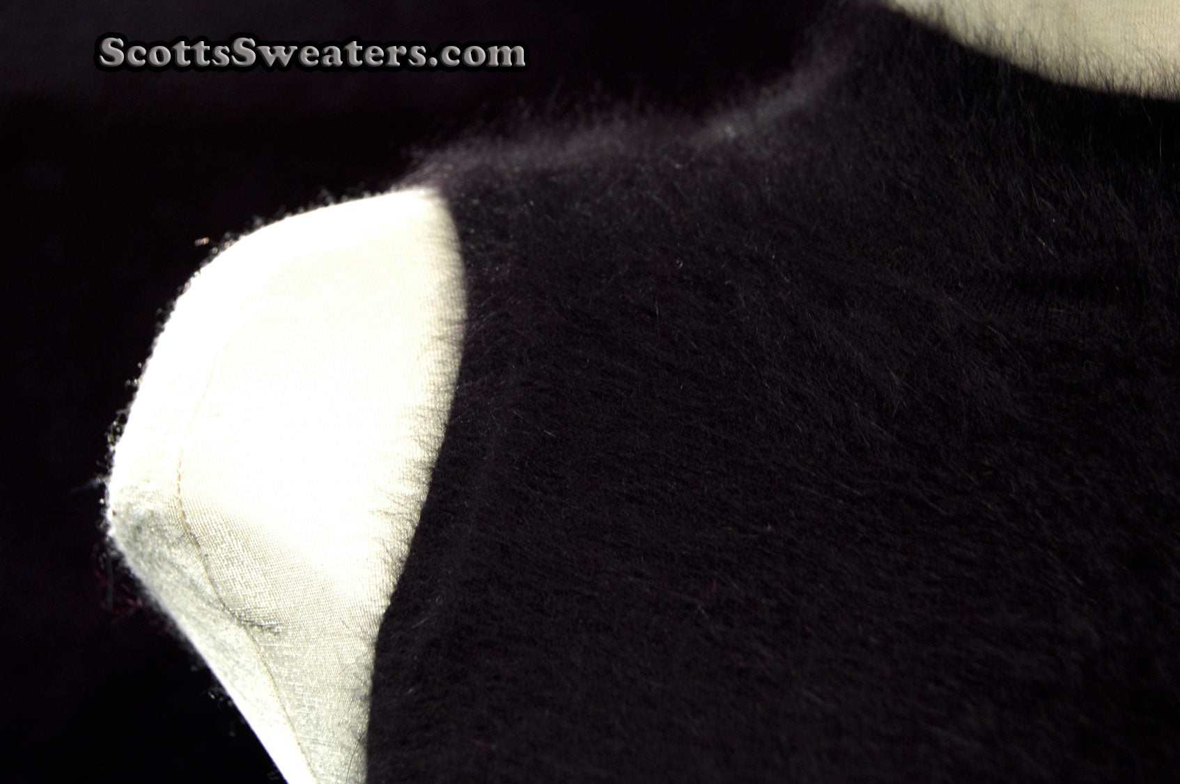 Sleeveless black angora sweaterdress by Next small size cling-fit style