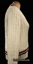 Woman's retro white cable-knit cardigan tennis sweater with red and blue trim stripes side view