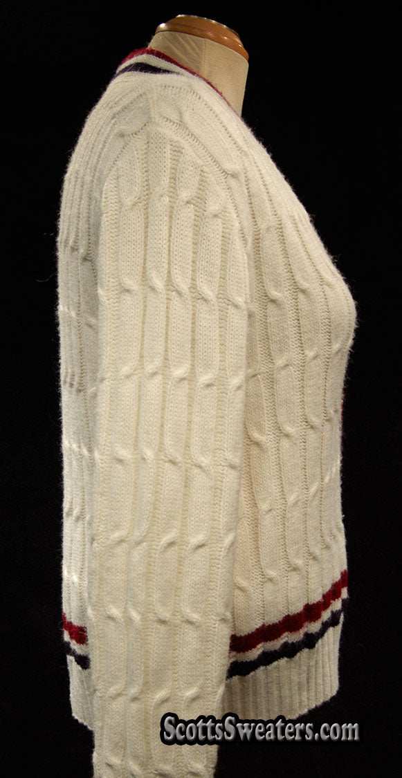 Woman's retro white cable-knit cardigan tennis sweater with red and blue trim stripes side view