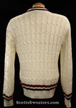 White cable-knit woman's retro cardigan sweater with red and blue trim stripes, size x-small
