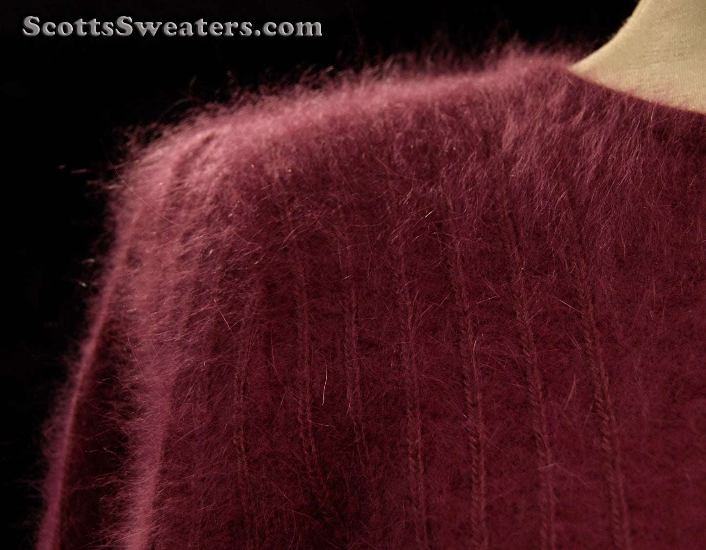 Woman's deep-purple 2-piece matching Angora sweater set with short-sleeve sweater and open-front cardigan featuring leather applique