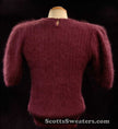 Woman's 2-piece matching deep-purple angora sweater set with short-sleeve top and open-front cardigan featuring leather appliqué
