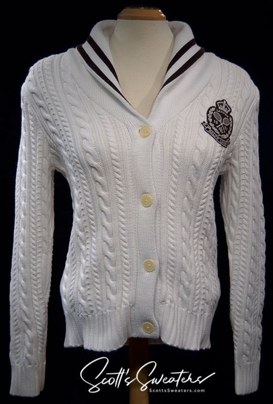 Woman's white cable-knit cardigan with shawl collar and Ralph Lauren crest by Ralph Lauren Active