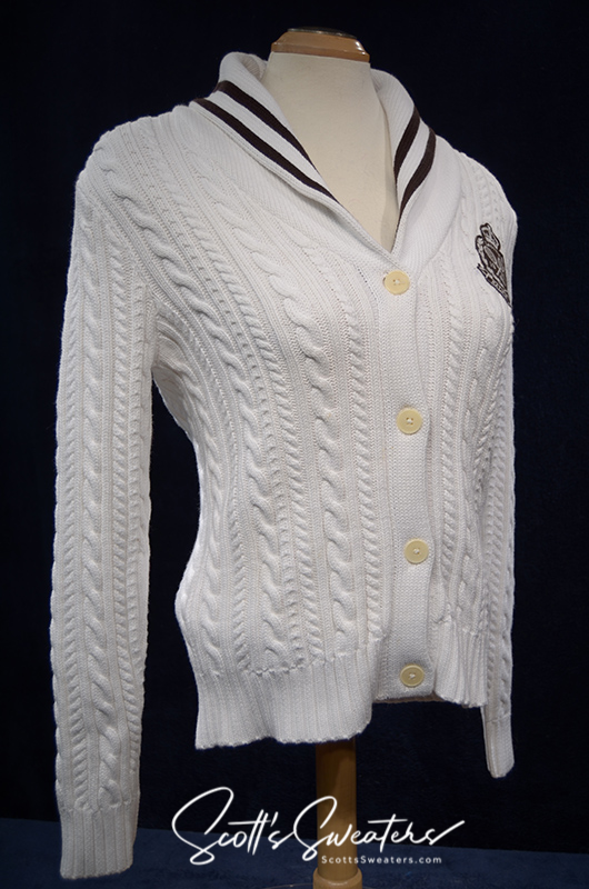 Woman's white cable-knit cardigan with shawl collar and Ralph Lauren crest