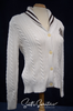 Woman's white cable-knit cardigan with shawl collar and Ralph Lauren crest