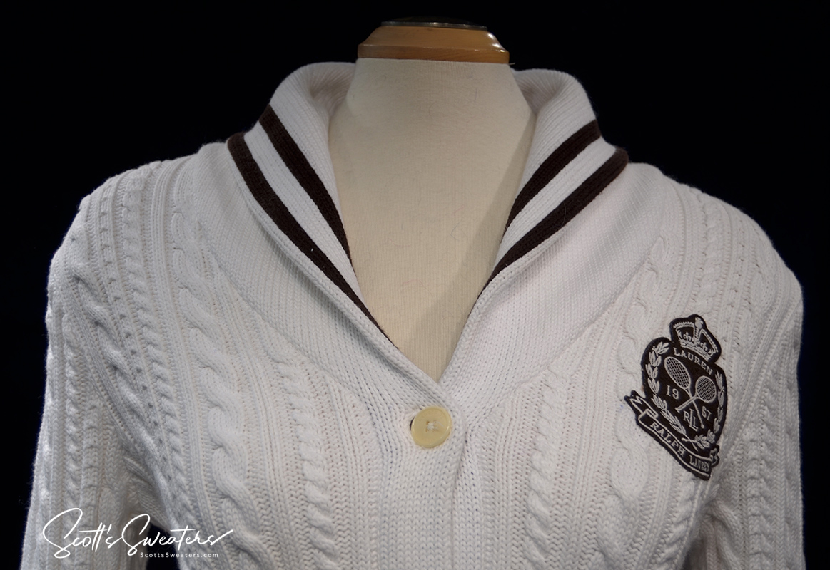 Woman's white cable-knit cardigan with shawl collar and Ralph Lauren crest by Ralph Lauren Active
