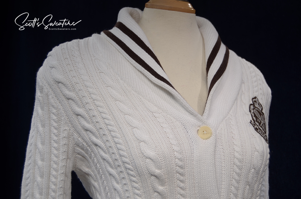 Woman's white cable-knit cardigan with shawl collar and Ralph Lauren crest by Ralph Lauren Active