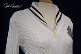 Woman's white cable-knit cardigan with shawl collar and Ralph Lauren crest by Ralph Lauren Active