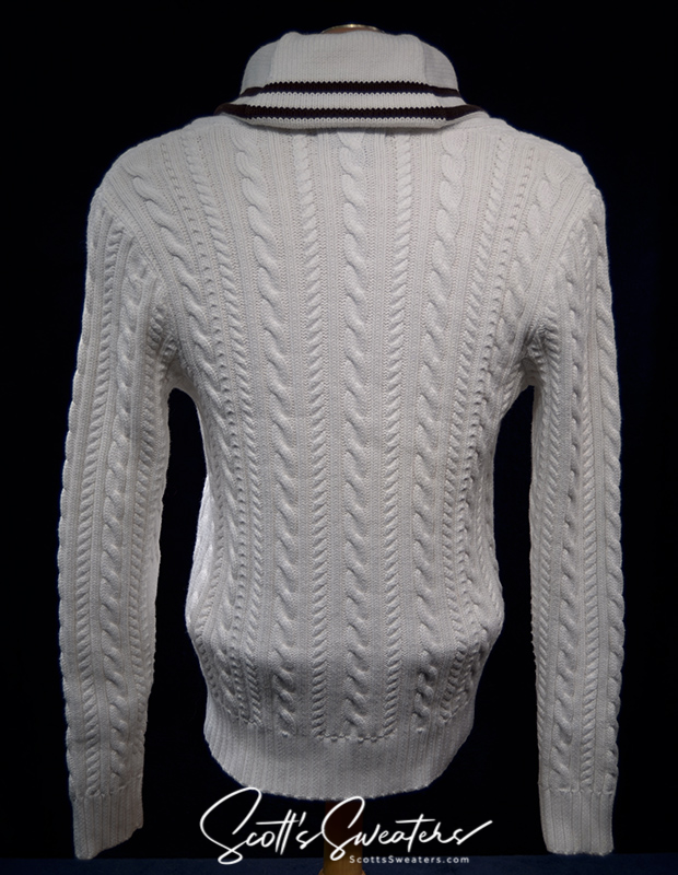 White cable-knit cardigan sweater with shawl collar and striped trim, Ralph Lauren Active women's tennis sweater.