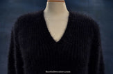 Women's black V-neck angora sweater by Michael Kors displayed on mannequin
