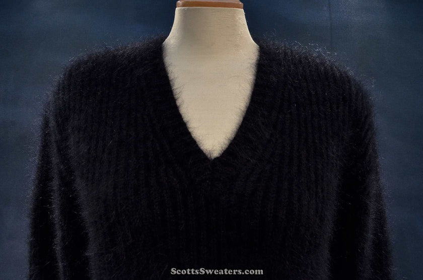 Women's black V-neck angora sweater by Michael Kors displayed on mannequin