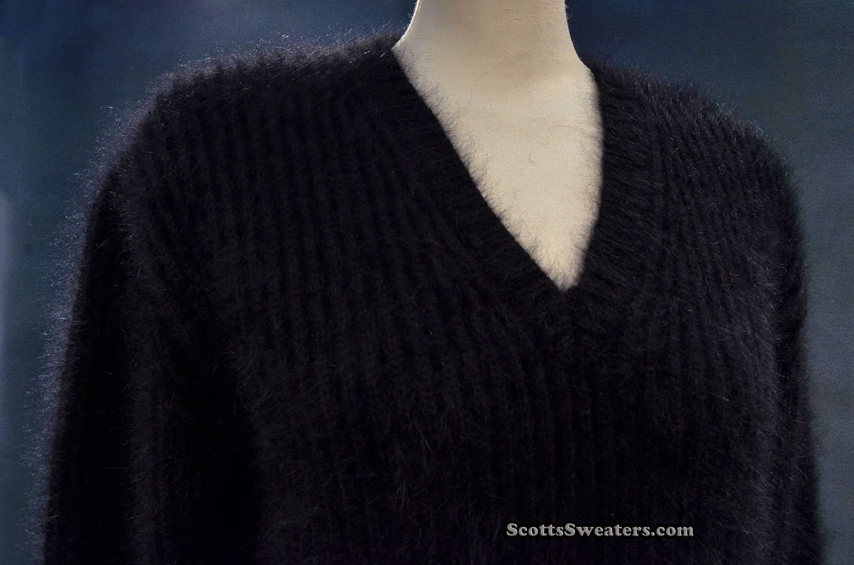 Woman's black V-neck angora sweater by Michael Kors on mannequin