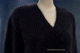 Woman's black V-neck angora sweater by Michael Kors on mannequin