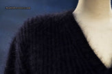 Woman's black V-neck angora sweater by Michael Kors displayed on mannequin