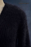 Woman's black V-neck angora sweater by Michael Kors in medium-large size