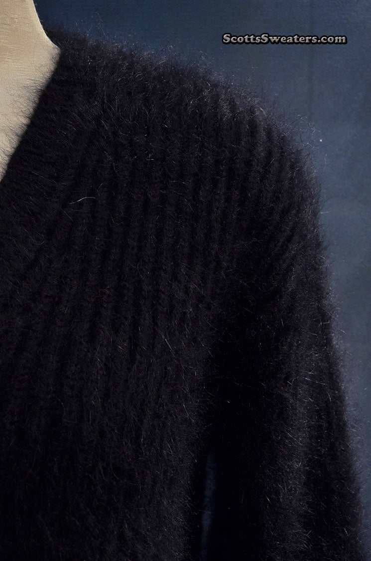 Woman's black V-neck angora sweater by Michael Kors in medium-large size