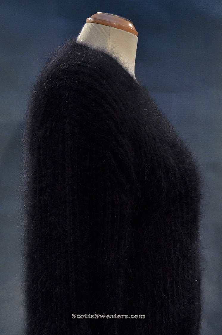 Black angora V-neck sweater for women by Michael Kors displayed on mannequin.