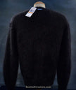 Woman's black V-neck angora sweater by Michael Kors displayed on mannequin with tags visible