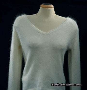 Woman's white angora V-neck sweater with split cuffs by H&M medium size