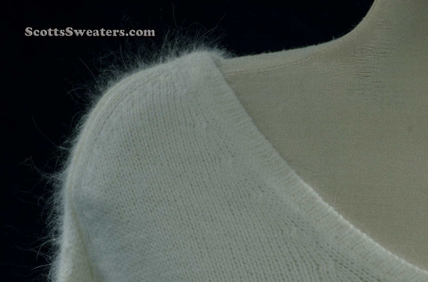 Woman's white angora V-neck sweater with split cuffs by H&M medium size