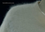 Woman wearing white short-sleeved V-neck angora sweater by Just Clothes