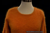 Woman wearing a golden roundneck soft angora sweater by Scott's Sweaters