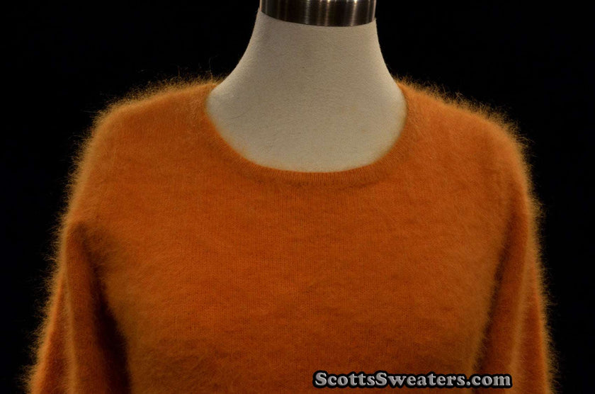 Woman wearing a golden roundneck soft angora sweater by Scott's Sweaters