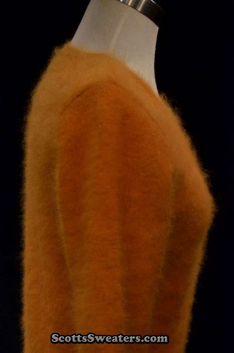 Woman wearing a gold soft fuzzy angora roundneck sweater by Scott's Sweaters