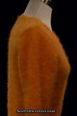 Woman wearing a gold soft fuzzy angora roundneck sweater by Scott's Sweaters