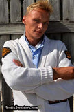 Man wearing retro classic letterman sports cardigan sweater in white with patches on sleeves