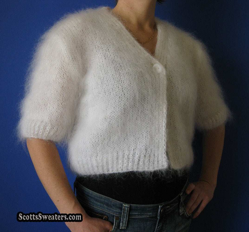 Woman's hand-knitted mohair shrug with half or three-quarter sleeves in multiple colors