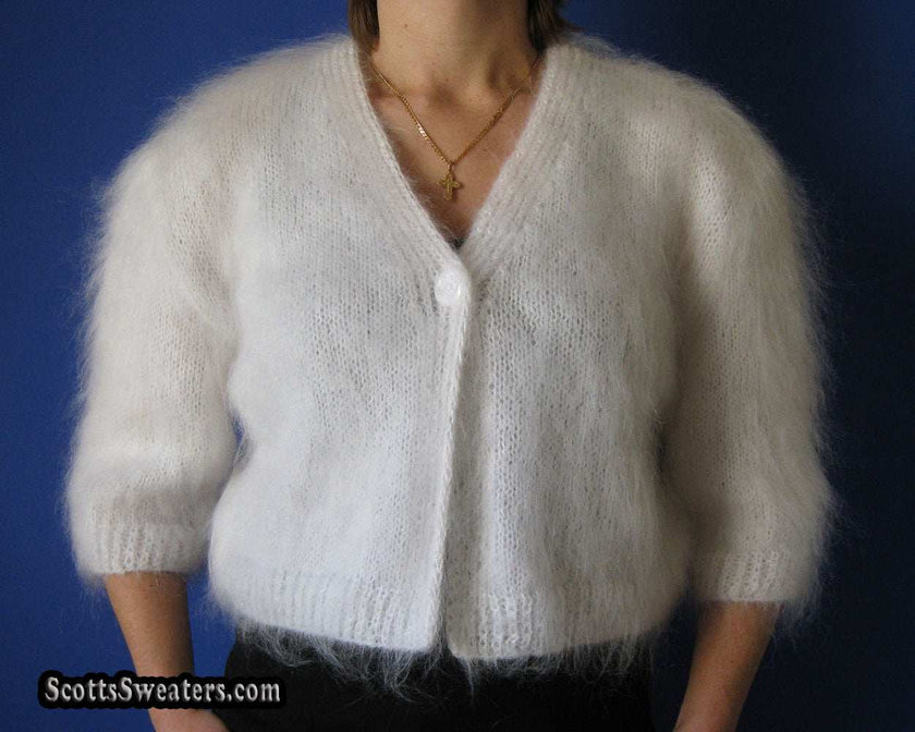 Woman's hand-knitted mohair shrug with half- or three-quarter sleeves available in various colors and sizes
