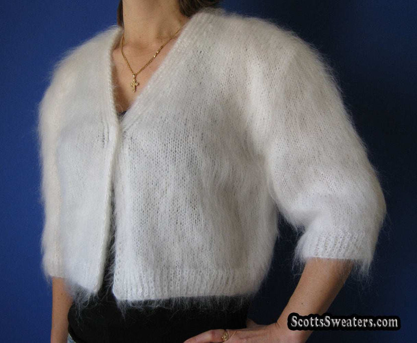 Woman's hand-knitted mohair shrug with half or three-quarter sleeves