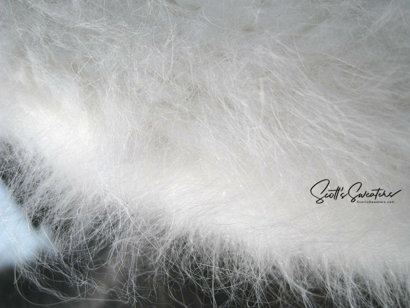 Siberian woman's white hand-knit angora Ushanka hat with ear flaps