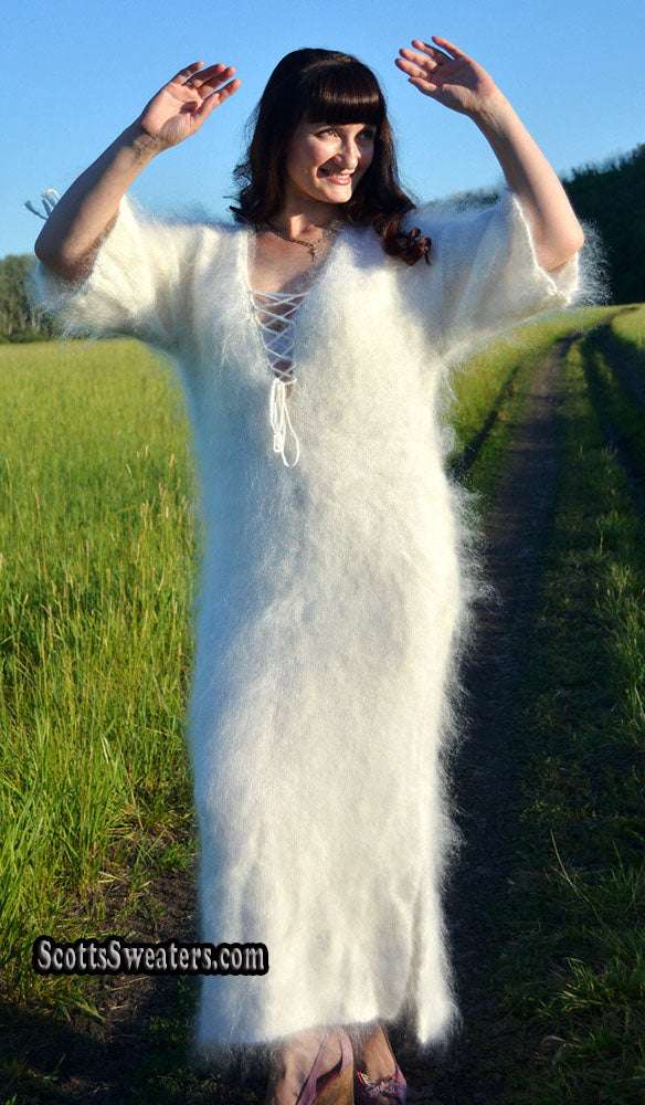 Ivory fuzzy mohair full-length sweaterdress with open-lace neckline and half sleeves on woman outdoors