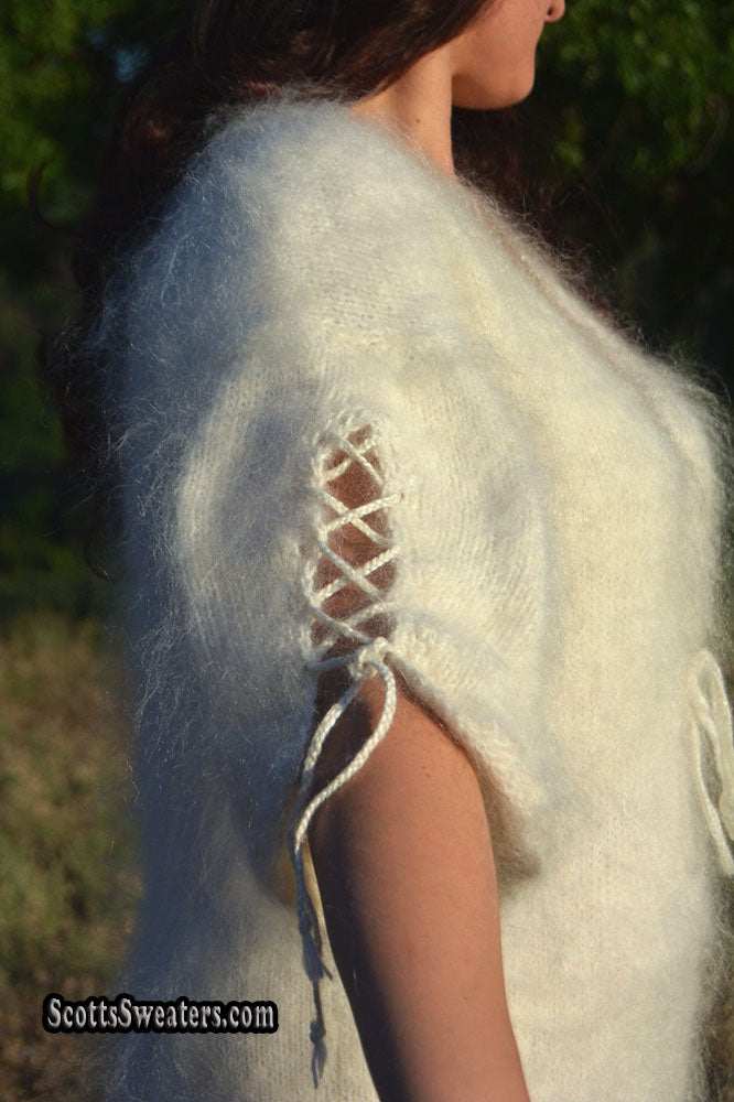 Ivory fuzzy mohair sweaterdress with open-lace half-sleeves and slit-bottom detail