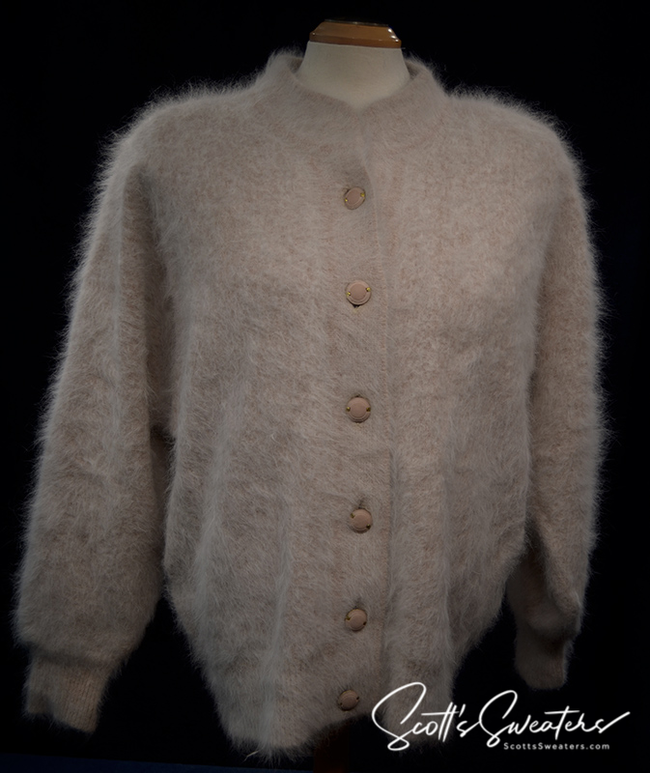 Woman wearing beige angora cardigan sweater by Connie A. Lee Nylon lined small-medium
