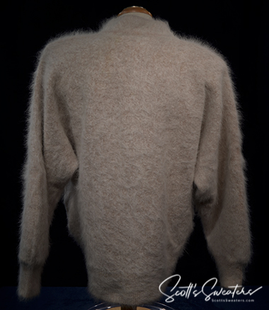 Woman wearing beige angora cardigan sweater by Connie A. Lee, small-medium size